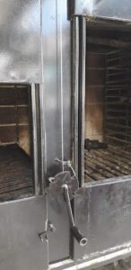 A black metal door with a silver handle.