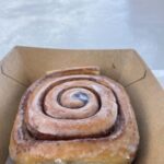 A delicious looking pastry with a swirl pattern on top.