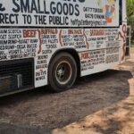 A food truck with a menu of various foods.