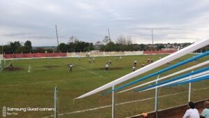 A group of young men playing soccer on a field.