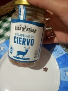 A jar of Astal Negra sits on a plate, ready to be used.