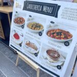 A menu board for a restaurant that serves Italian food.