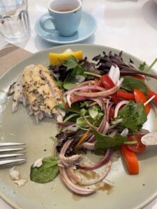 A plate of food with a fork and knife on it.