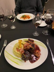 A plate of food with a fork and knife on the side.