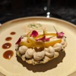 A plate of food with a sauce drizzled over it.