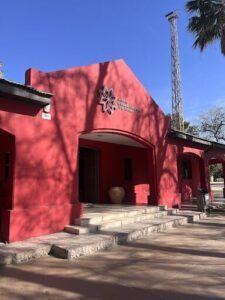 A red building with a white star on the side.