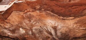 A rock with hand prints on it.