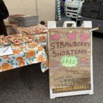 A sign advertises a free strawberry shortcake.