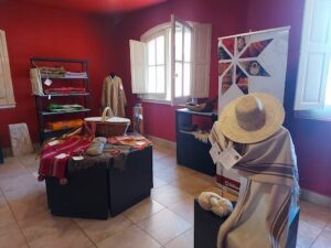 A store with a display of hats and scarves.