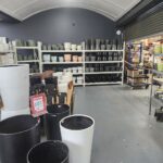 A store with a large variety of vases and pots.