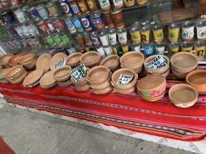 A table full of bowls with prices on them.