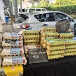 A table full of eggs for sale.
