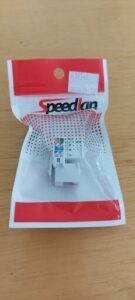 A white and red package with a white item inside.