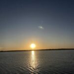 A beautiful sunset over a body of water.