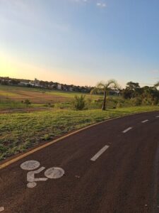 A bicycle path is marked with a white arrow on the road.