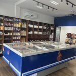 A blue and white display case filled with various food items.