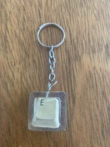 A key chain with a letter E on it.