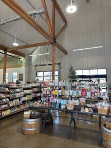 A store with a large wooden rack filled with various items.