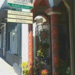 A storefront with a sign for a nonprofit store.
