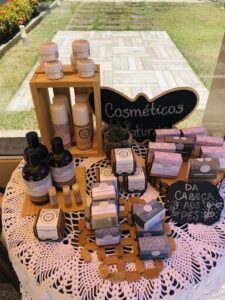 A table full of cosmetic products, including lotions, soaps, and shampoos.