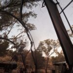A view of the sky through a tent canopy.