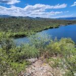 A beautiful view of a lake with mountains in the background.