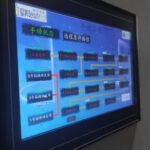 A computer monitor with a blue background and red text.