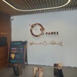 A sign for O-Park 1 is displayed on a wall.