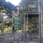 A sign that says "Exit Only" is on a gate.
