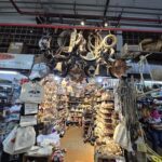 A store with a variety of items, including a cow head and a hat.